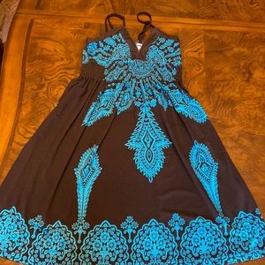 Adorable Brown and turquoise adjustable straps stretchy around the waist.